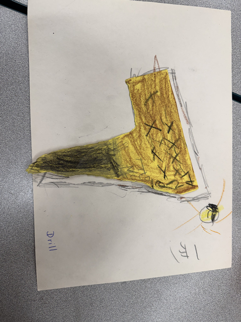 yellow drill made out of scrap paper