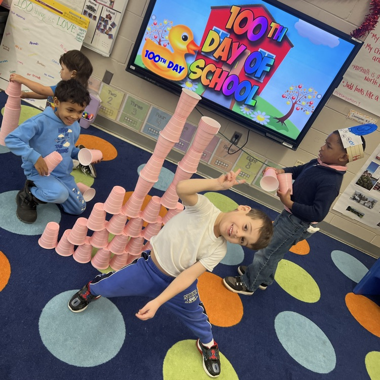 Students playing a stacking cup game