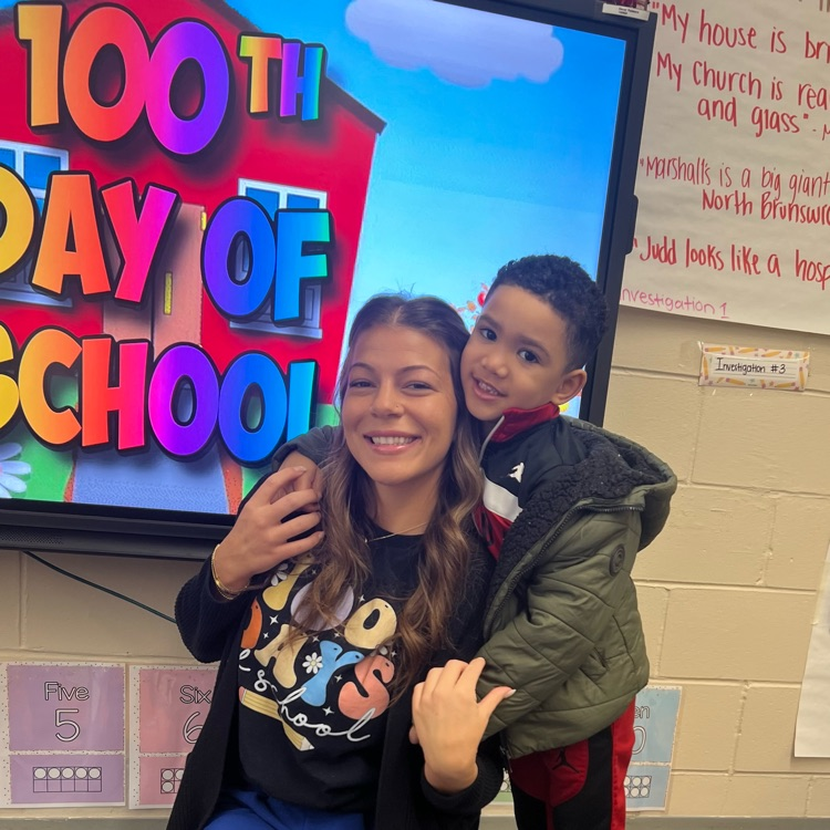 teacher and student posing for photo