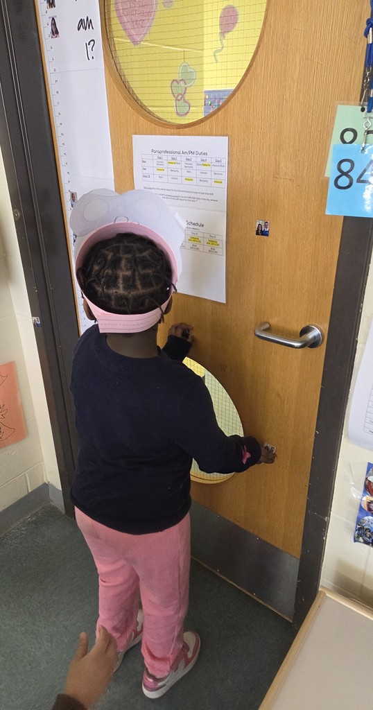 student looking at a clue on a door