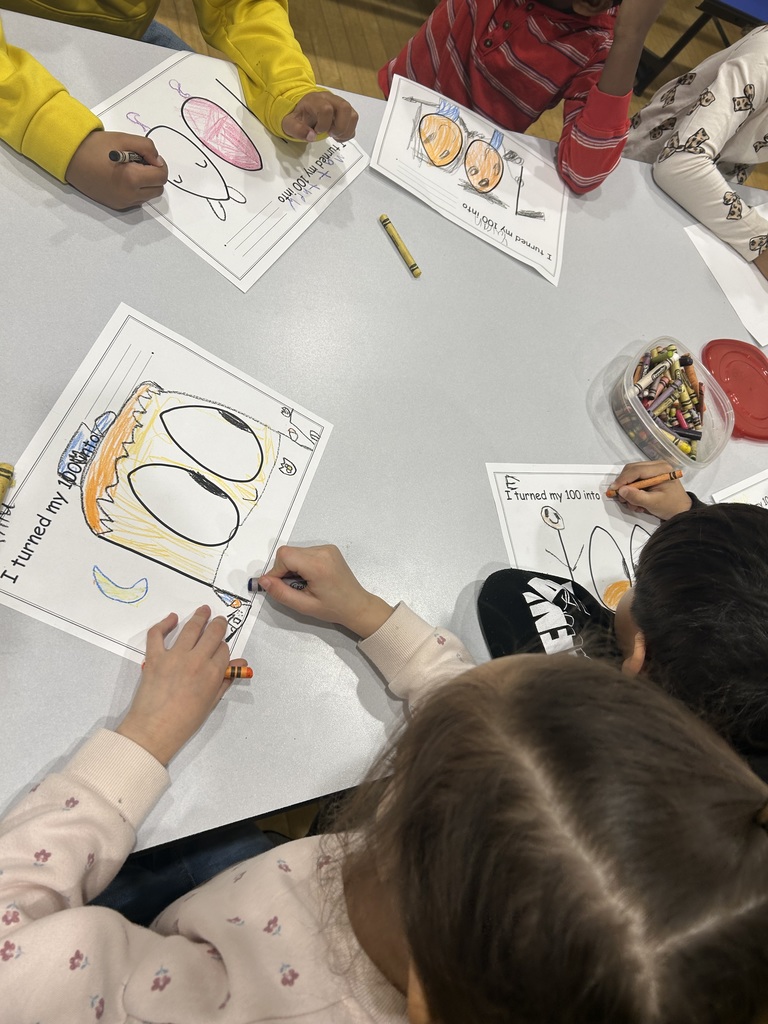 students turning the number 100 into something else by drawing on and around it