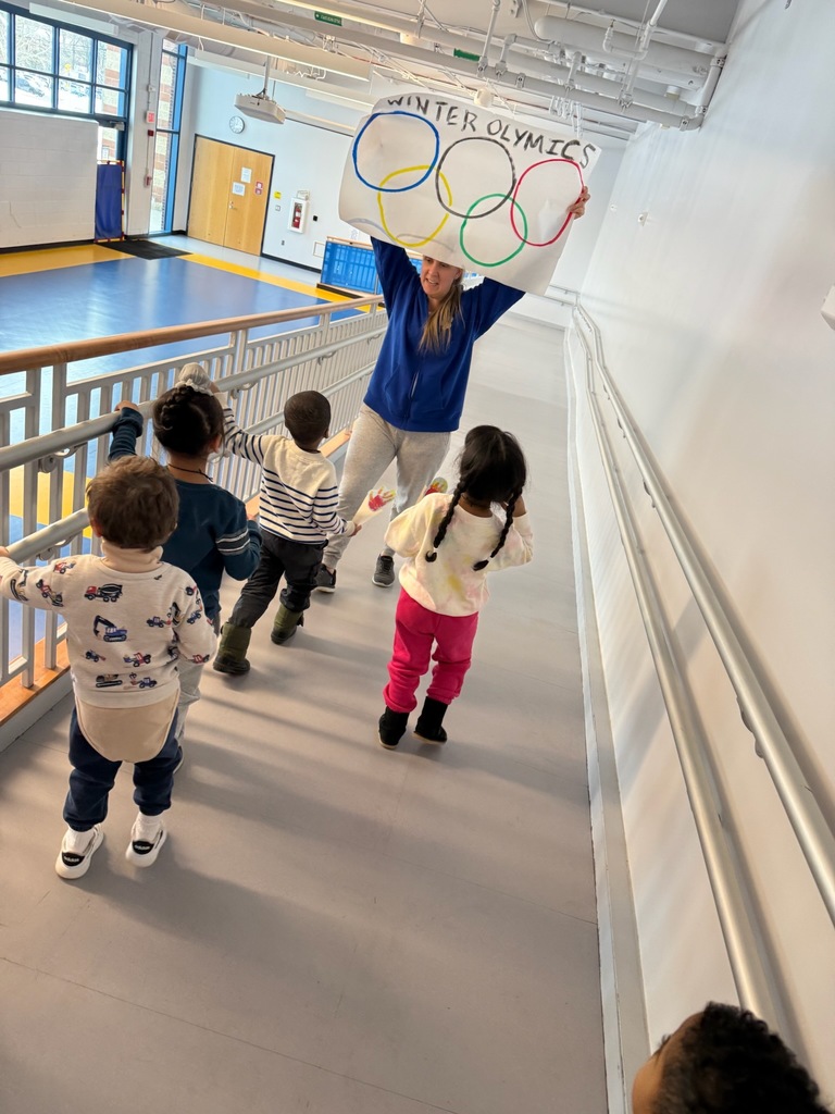 Students following an olympics sign