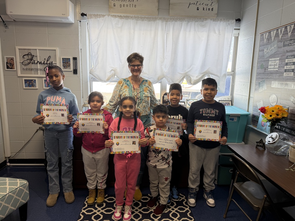 Sensational 7: Group of students standing with principal with certificates
