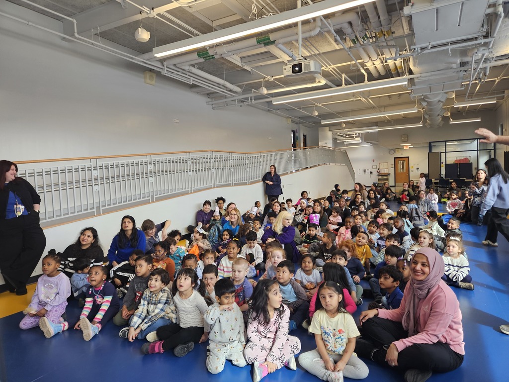 School assembly kids sitting on floor
