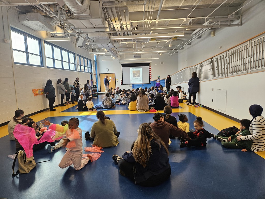 School assembly kids sitting on floor