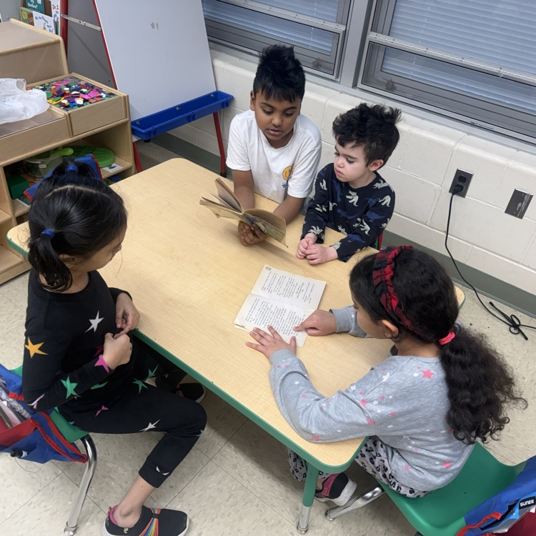 #Students sitting at the table reading
