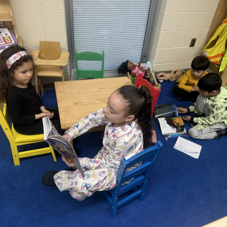 #Students sitting at the table reading