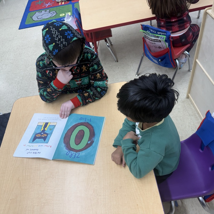#Students sitting at the table reading