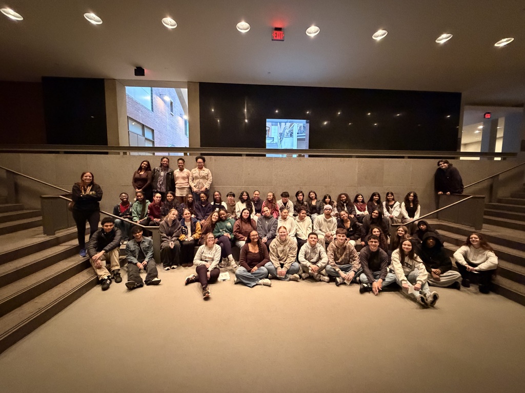 US Holocaust Memorial Trip 2026 - students sitting on floor of stairwell