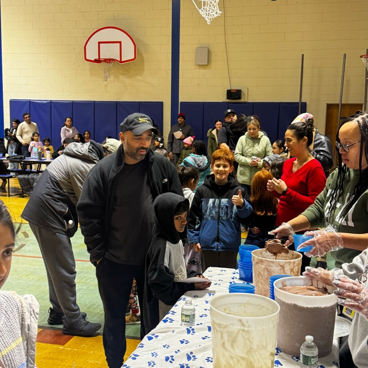 families playing bingo in a school cafeteria