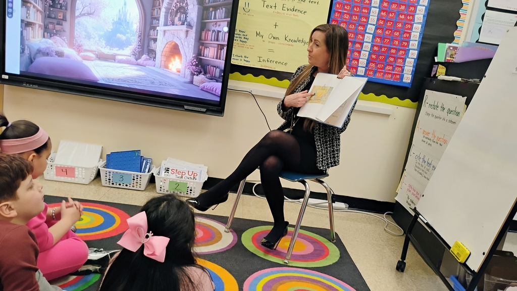 Mrs. Kita reading to Mrs. Tirado's 2nd grade class during Read Across America Week!