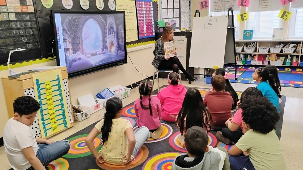 Mrs. Kita reading  'The Day Jimmy's Boa Ate the Wash!' 