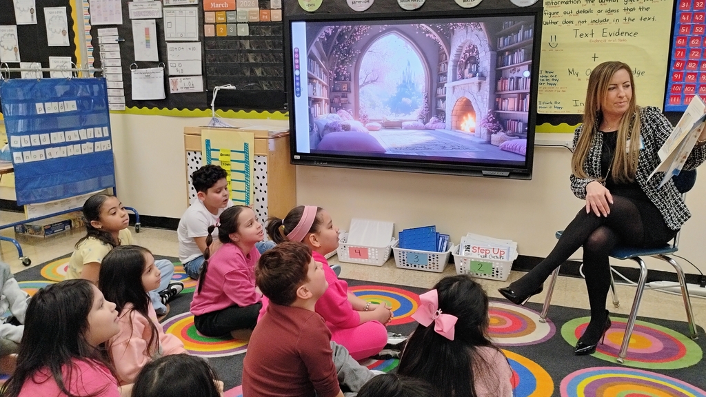 Mrs. Kita reading to Mrs. Tirado's 2nd grade class during Read Across America Week!