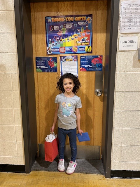 Student standing with giftbag