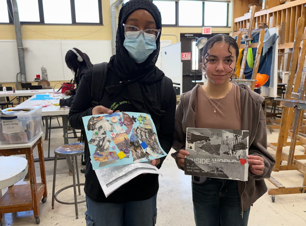 Students holding up their artwork