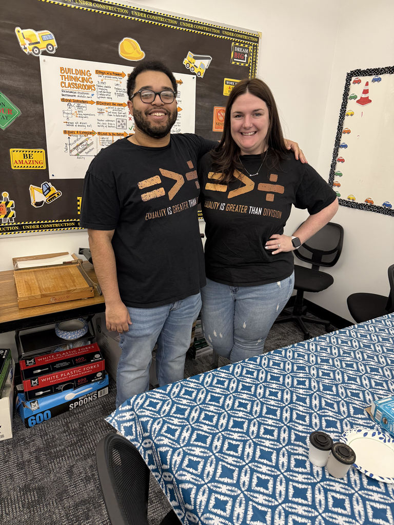 Teachers wearing Equality is Greater Than Division shirts