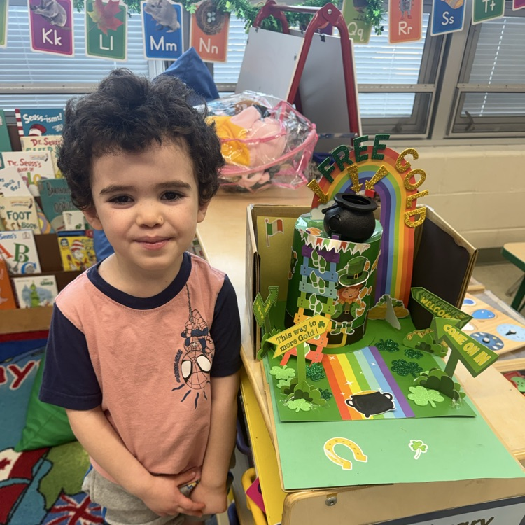 Student posing with Leprechaun Trap Family Project ☘️🌈