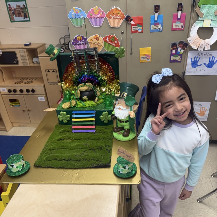 Student posing with Leprechaun Trap Family Project ☘️🌈