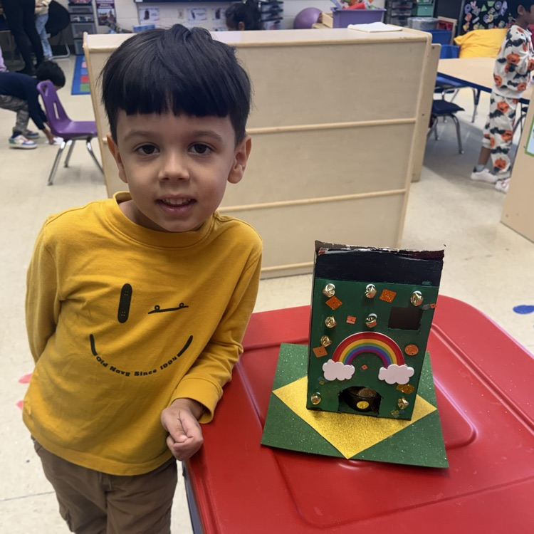 Student posing with Leprechaun Trap Family Project ☘️🌈