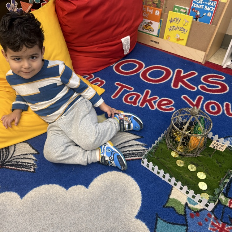 Student posing with Leprechaun Trap Family Project ☘️🌈