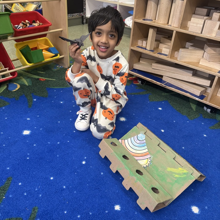 Student posing with Leprechaun Trap Family Project ☘️🌈