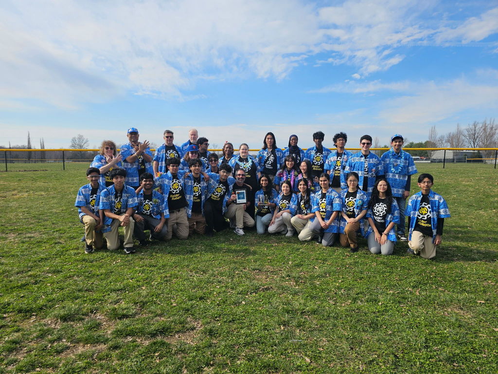 Raider Robotix Team picture with their Gracious Professionalism Award