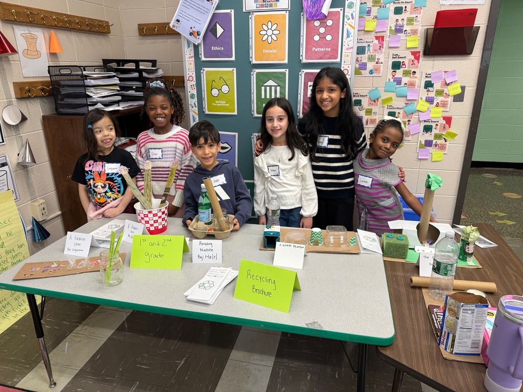 1st and 2nd Graders displaying their projects