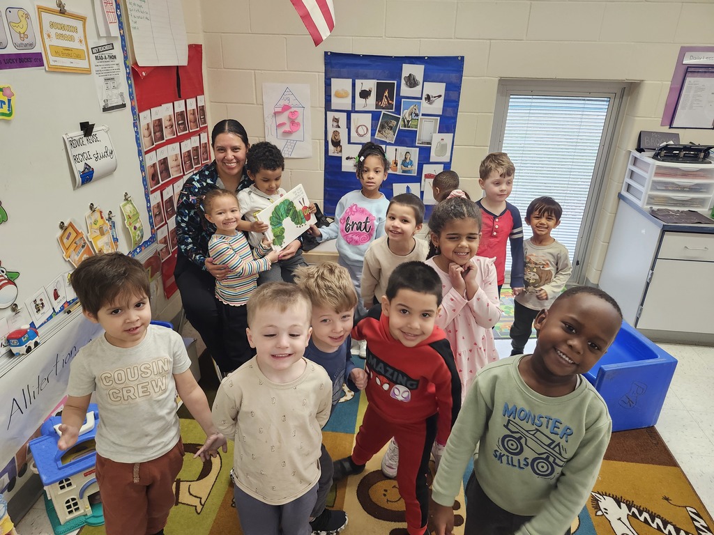 Mystery Readers Story time. Parent standing with group of students