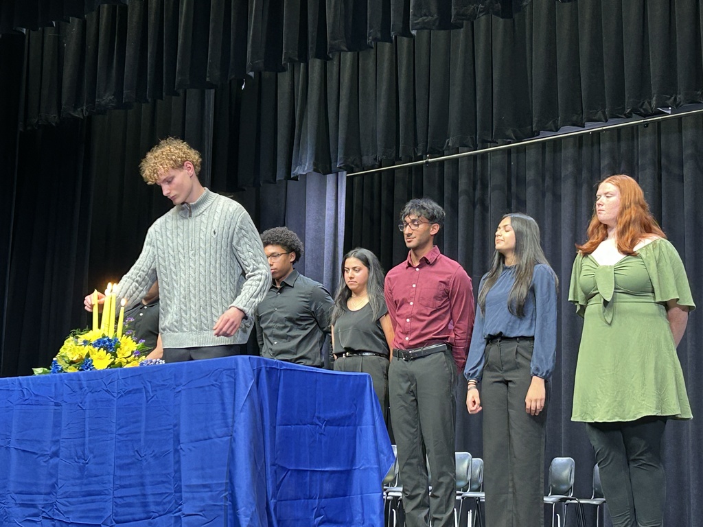 Student lighting candle