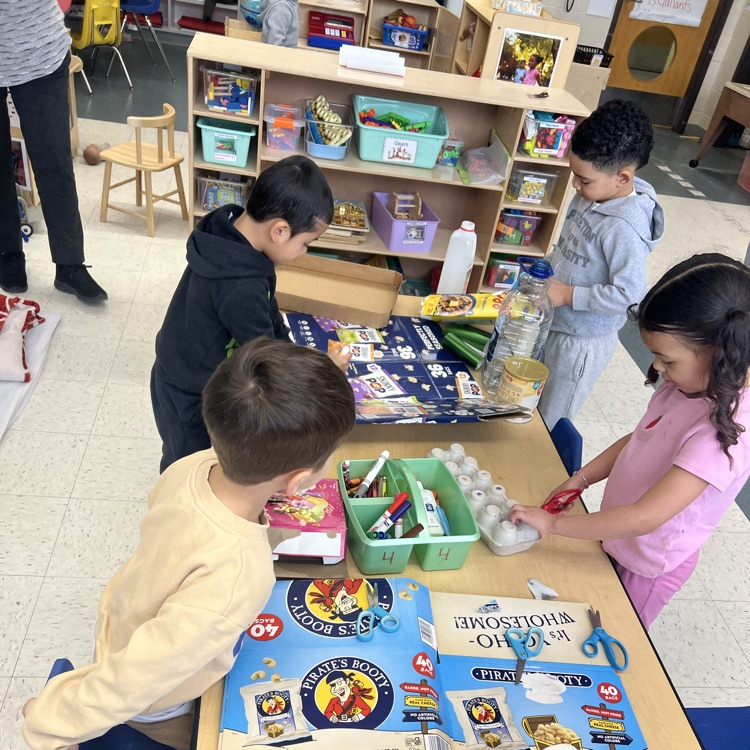 Students working with recyclable items to make projects