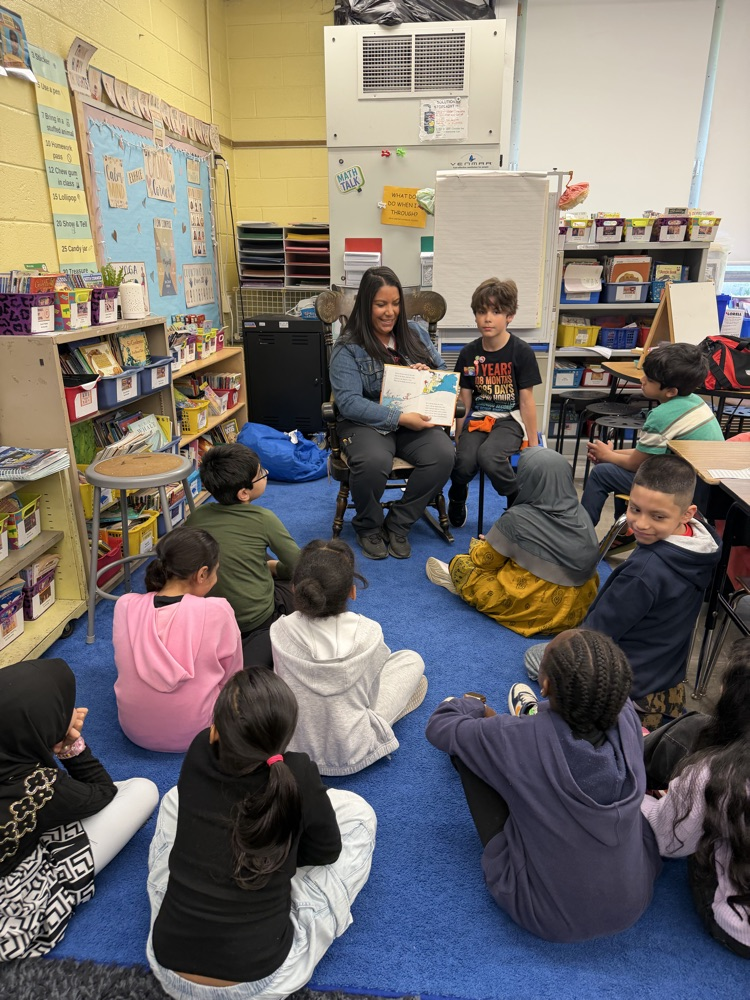 Class listening to a guest reader