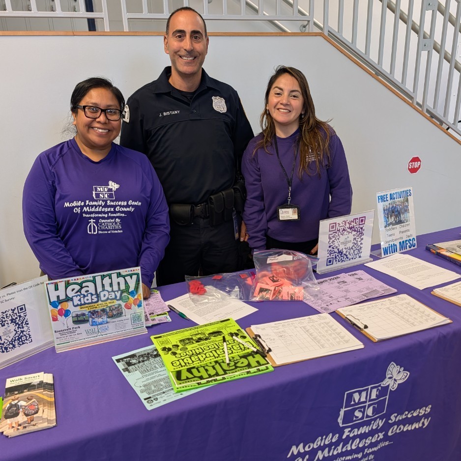 Staff standing at an informational table