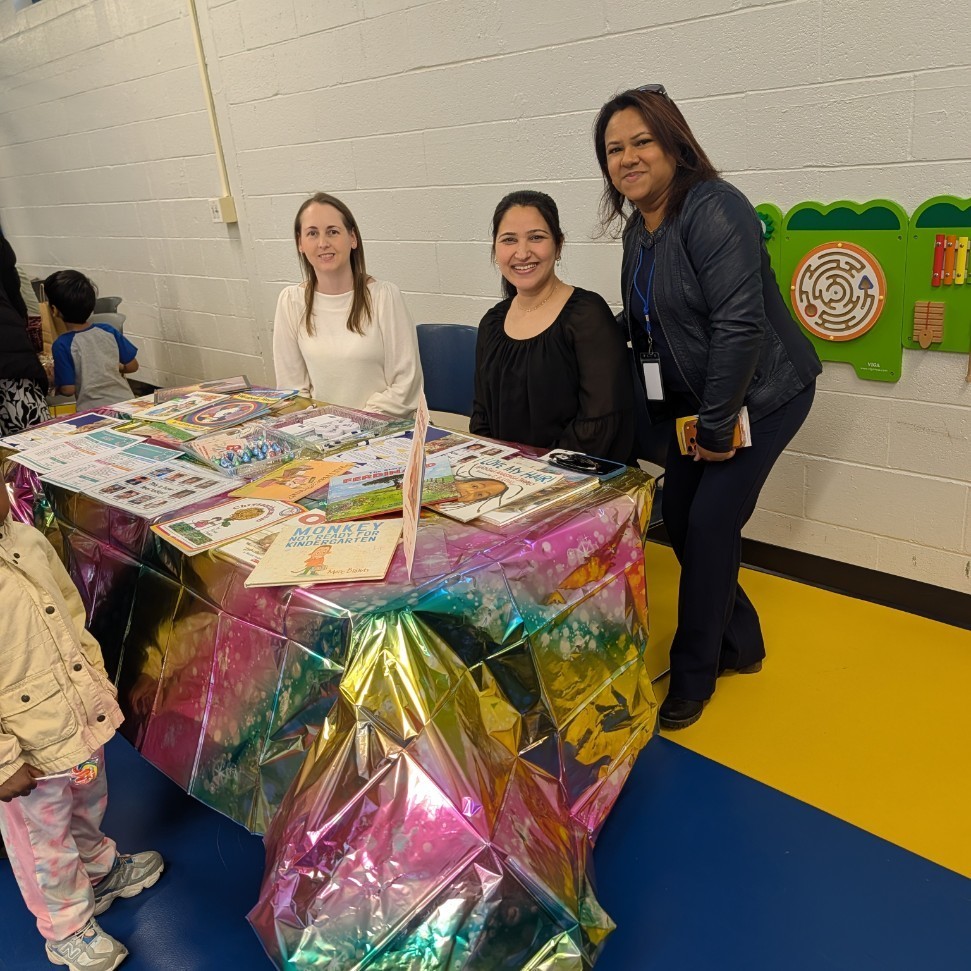 Staff standing at an informational table