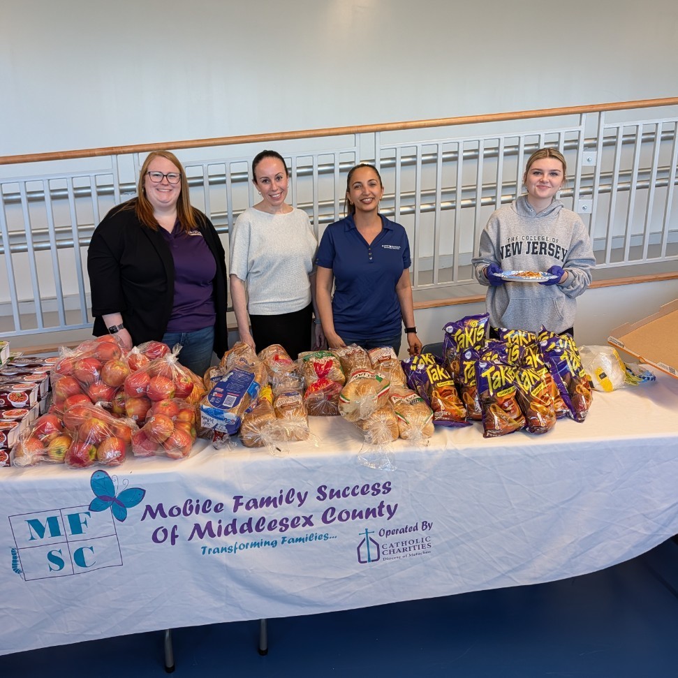 .Staff standing at an informational table