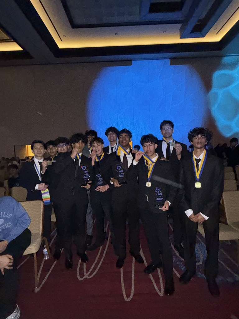 Our winners posing with their medals fresh off the stage 