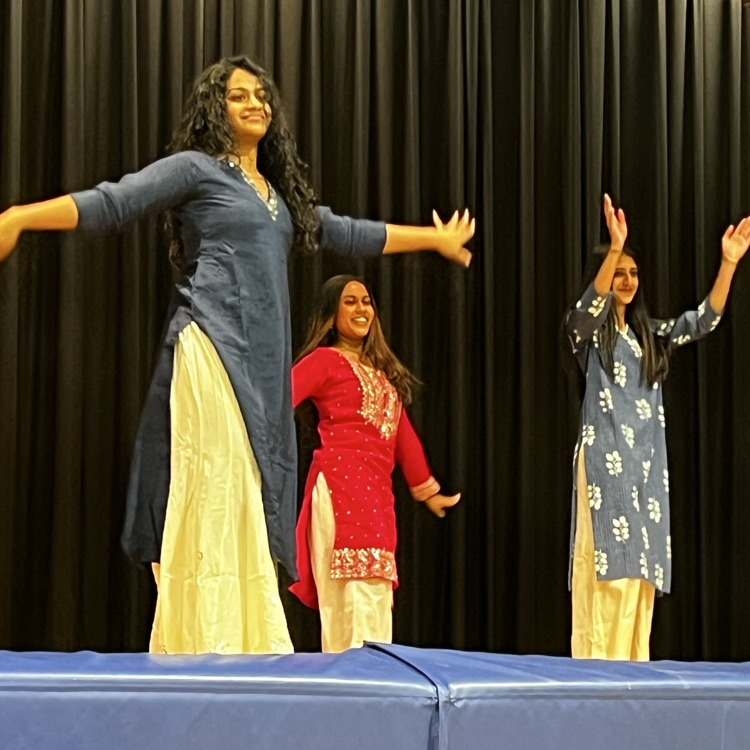 Students dancing on stage at International Night