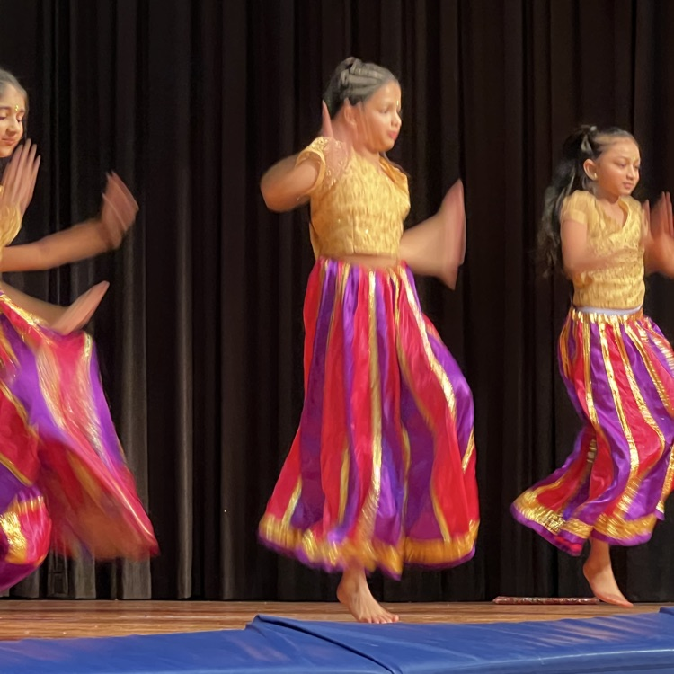 Students dancing on stage at International Night