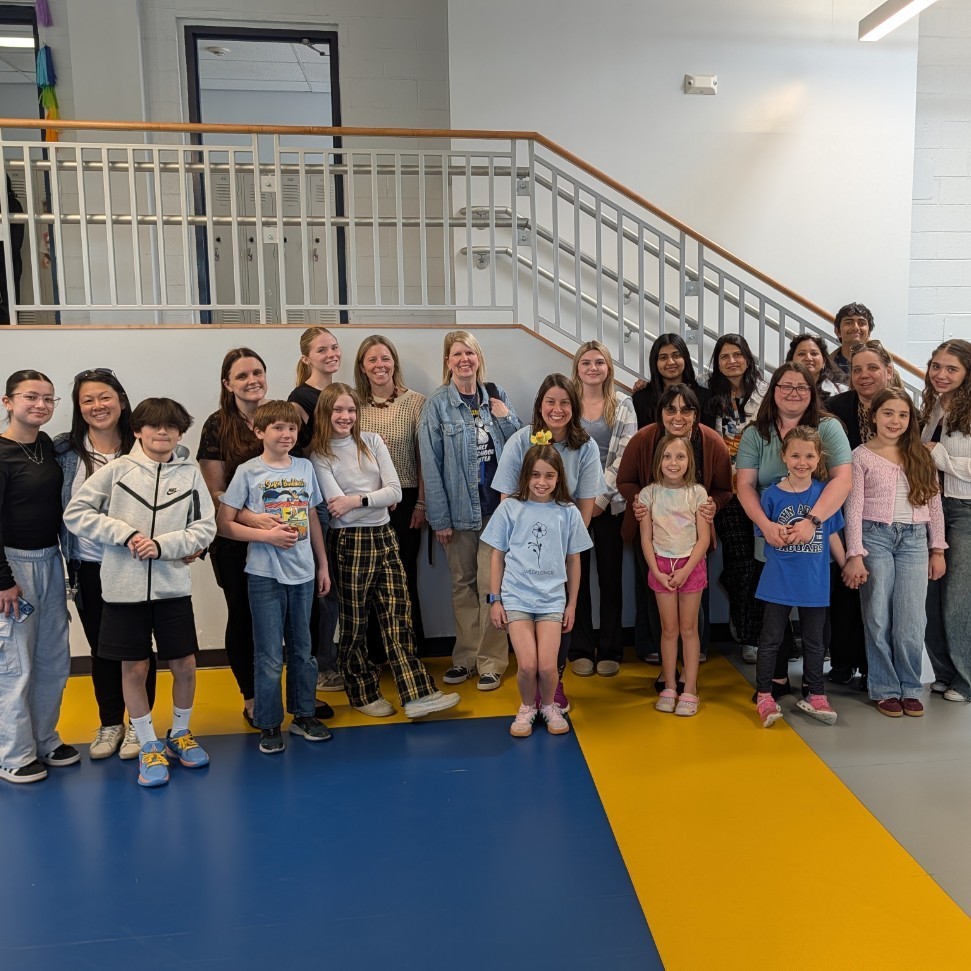 Group of kids and parents posing together