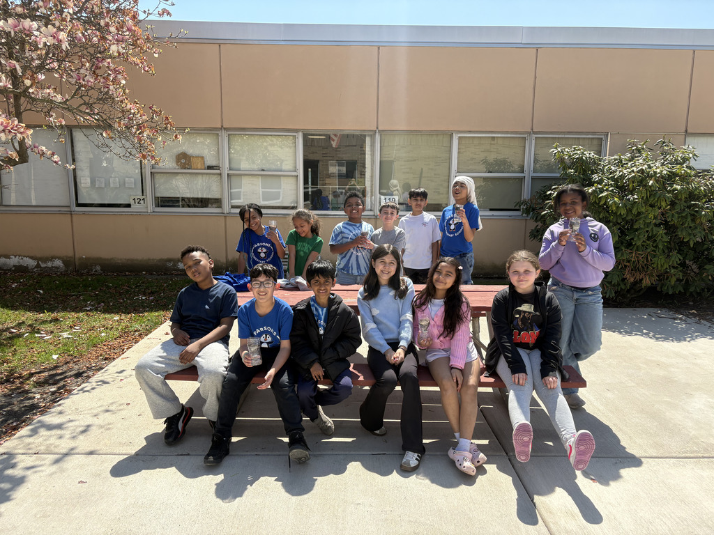 Parsons Student Council members and their recycled planters.
