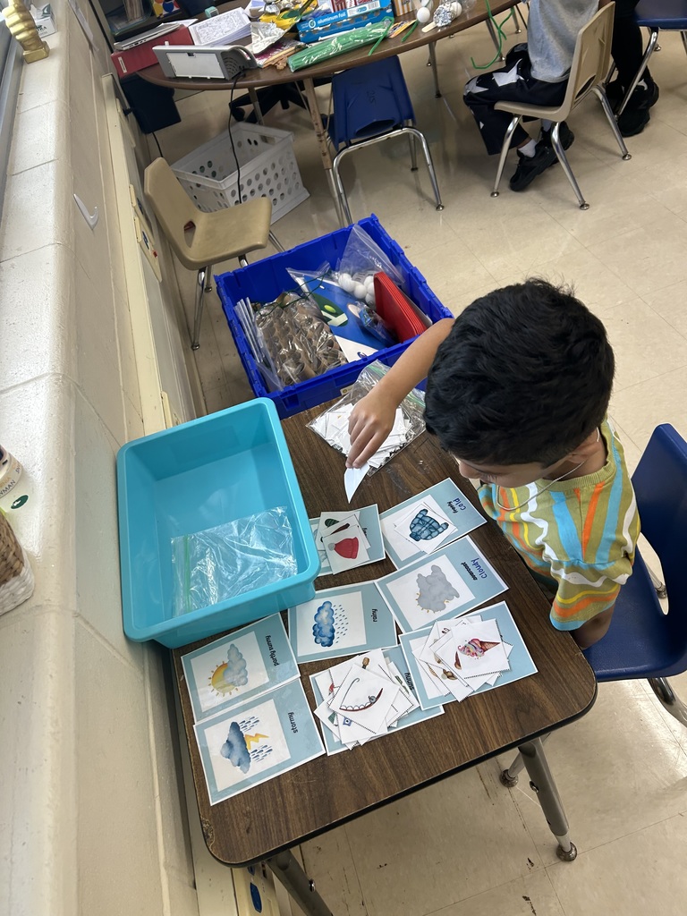 a student sorting weather pictures