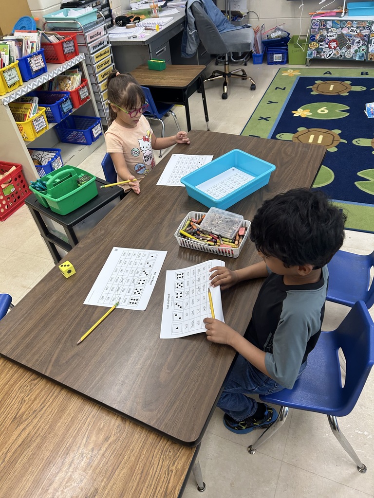 students working together to read words