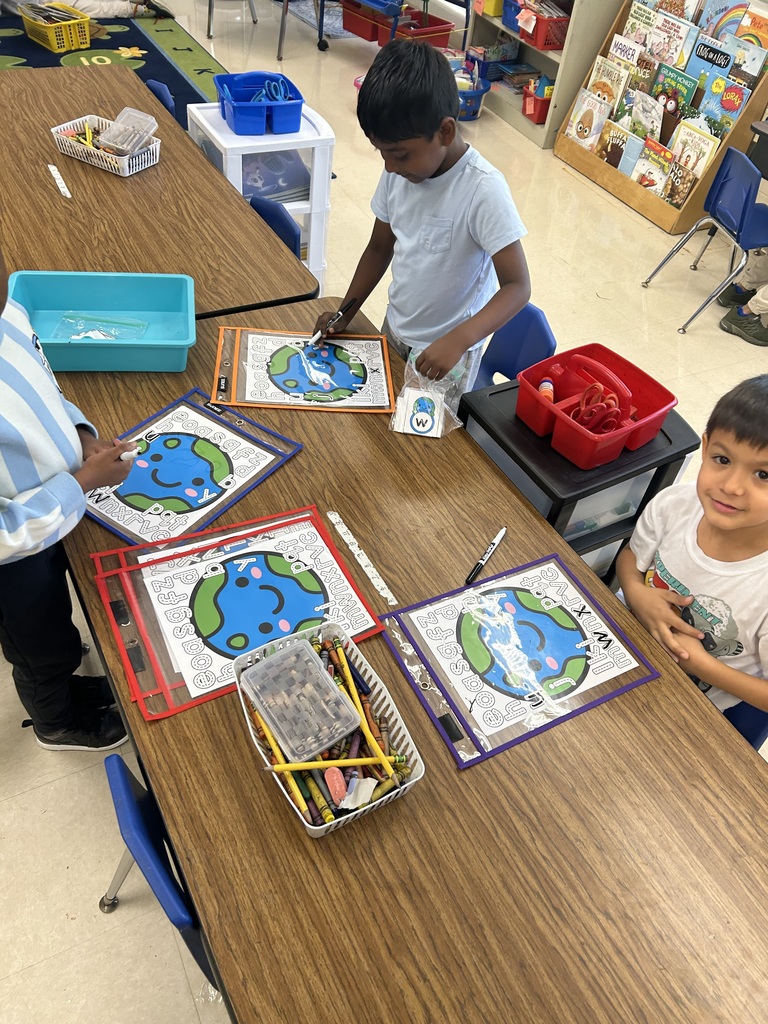 students tracing lowercase letters