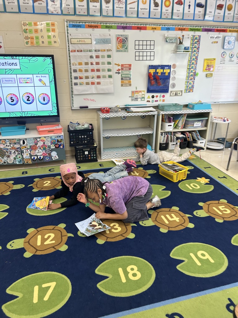 students reading books about weather and seasons