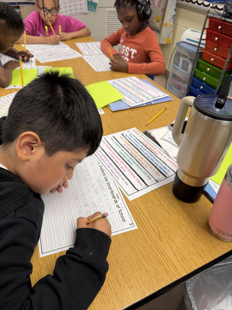 Students working on worksheets at a table