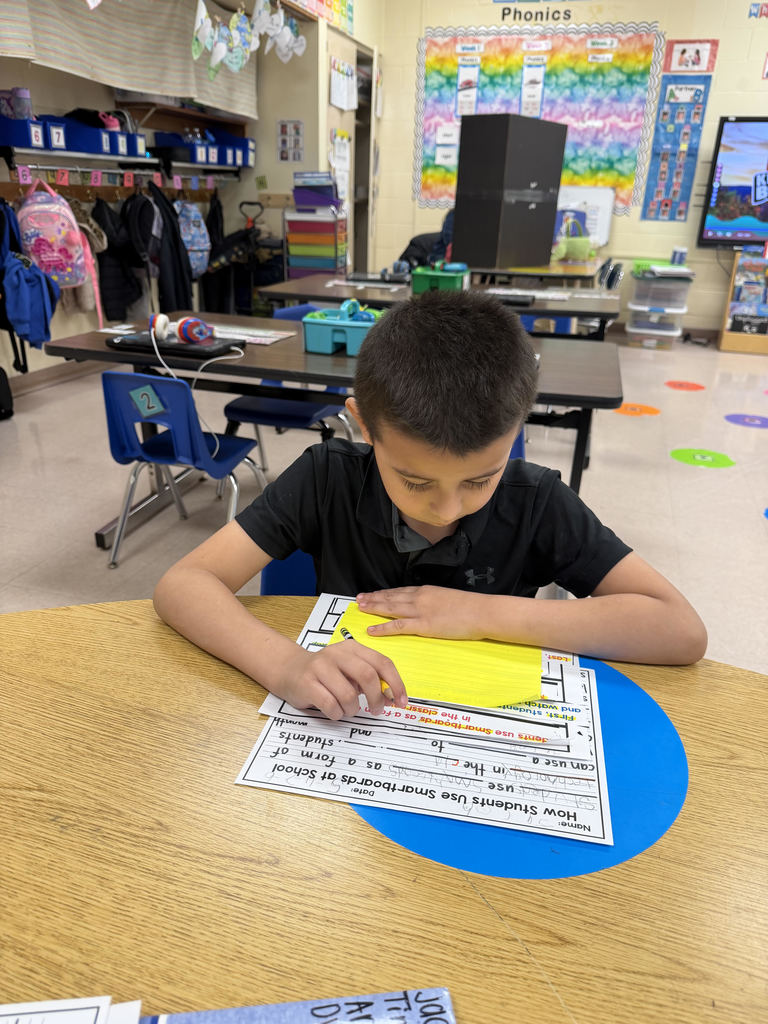 Student working on worksheets at a table