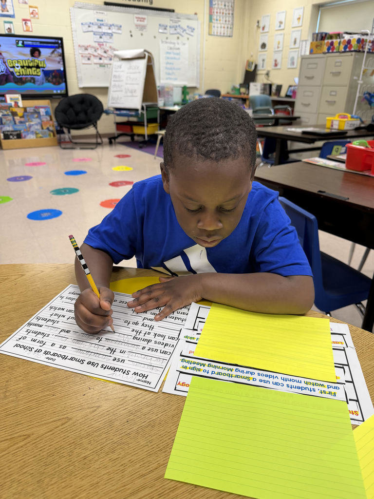 Student working on worksheets at a table