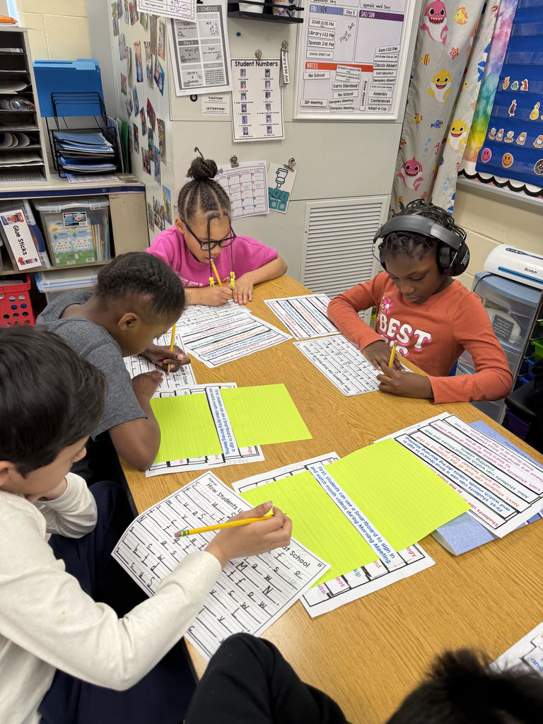 Students working on worksheets at a table