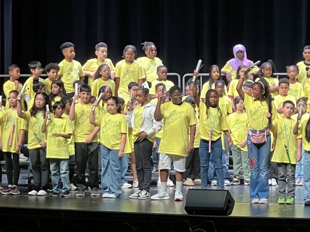 Judd students on stage singing