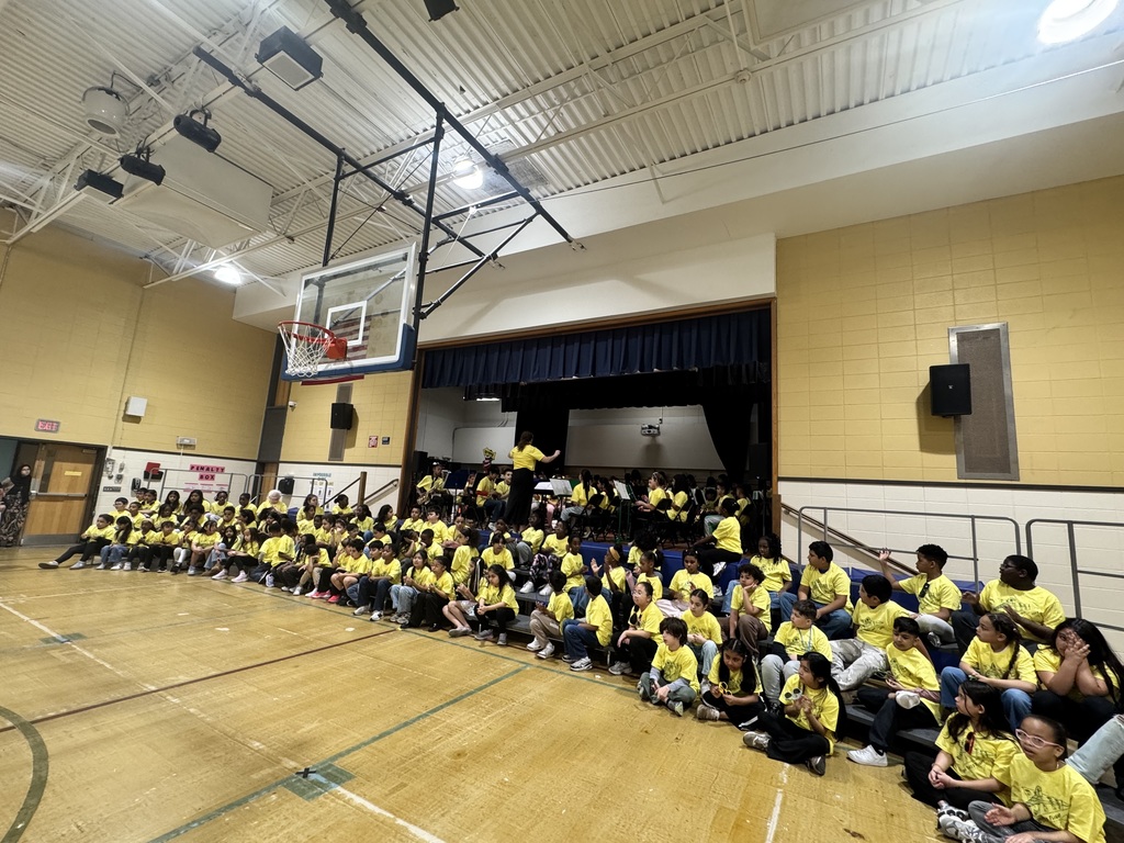 Students assembled in yellow shirts