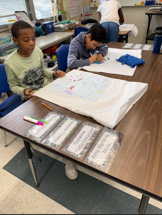 Kids working on posters called positive pillowcase